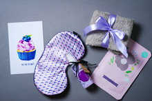 Beautiful Flat Lay With Cute Night Eye Mask, Gift Card And Present Box Isolated On Grey Background. Girls Stuff. Violet Concept. Top View. Present Idea