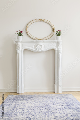 Real Photo Of White Room Interior With Faux Fireplace With Fresh