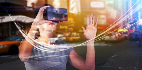 Poster - composite image of young woman wearing virtual video glasses