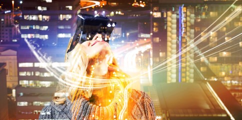 Poster - Composite image of happy blond woman using virtual reality