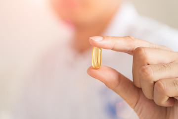 Close up man hand holding pills. Health care and medical concept.