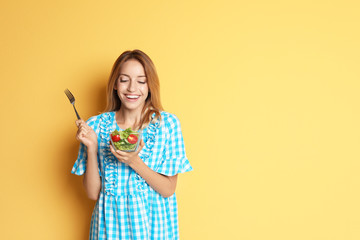 Poster - Happy slim woman with salad on color background. Weight loss diet