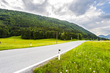 Wall Mural - Asphalt road in Austrian landscape