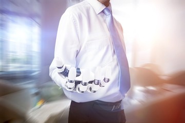 Poster - Composite image of midsection of businessman with robotic hand