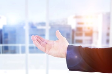Poster - Composite image of cropped hand of male executive showing hand
