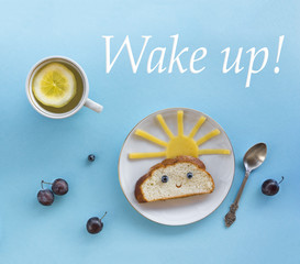 on blue background breakfast morning sun cloud sky rays joy cute sandwich healthy food berries blueberry plum bread cheese plate spoon serving napkin cup tea drink