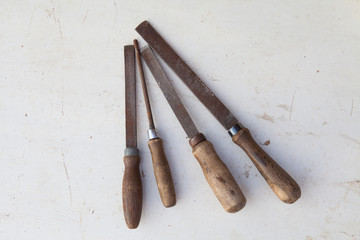 four old rasp on the desktop in the workshop