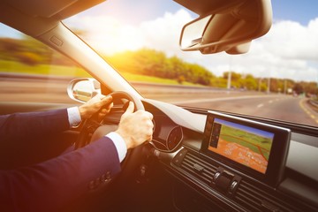 Poster - Side view of steering wheel and navigation system