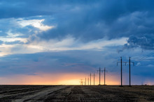 Rural Landscape With Power Poles At Sunrise
