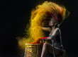 Colour powder splash drumming and hair flip action by young model