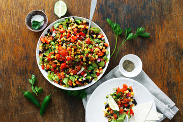 Wall Mural - Dinner table Taco salad on wooden table top view