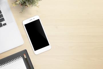 Aufkleber - Work desk with mobile phone, laptop, pad, pencil and plant on them.