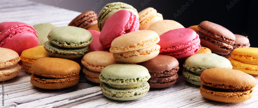 Sweet and colourful french macaroons or macaron on white backgro - obrazy, fototapety, plakaty 