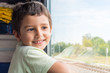 © Mariia Nazarova - cute cheerful boy goes to rest on the train