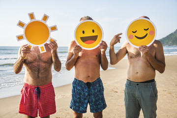 Senior friends having fun at the beach