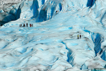 People hiking at the Jostedalsbreen glacier, the biggest glacier in continental Europe, located in Sogn og Fjordane county, Norway.