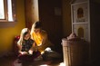 © Wavebreak Media - Daughter with mother reading a book in bedroom