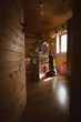 © Wavebreak Media - Girl playing with dollhouse in bedroom