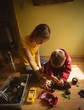 © Wavebreak Media - Mother and son repairing toy car in bedroom