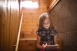 © Wavebreak Media - Girl using tablet computer while sitting on stairs at home