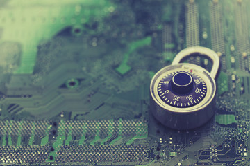 Poster - Padlock on a computer electronic circuit board. Data technology security concept
