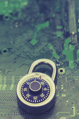 Poster - Padlock on a computer electronic circuit board. Data technology security concept