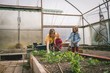 © Wavebreak Media - Kids helping mother in greenhouse plantation