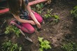 © Wavebreak Media - Girl sowing seeds in soil