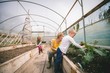 © Wavebreak Media - Mother and kids gardening in greenhouse