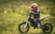© Wavebreak Media - Kid riding a bike in garden