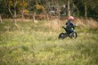 © Wavebreak Media - Kid riding a bike in garden