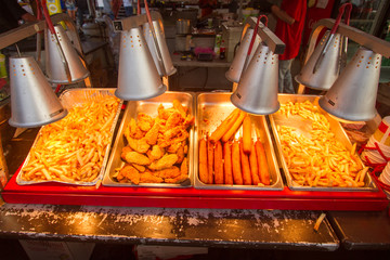 American Street food under warming lamp corn dogs fries chicken yum