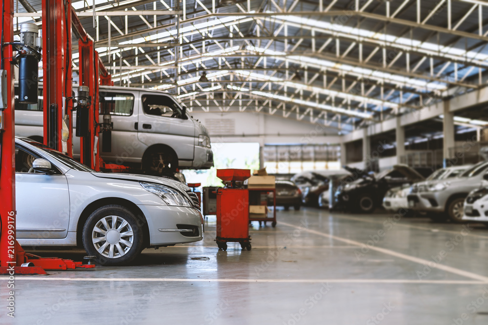 car repair station with soft-focus and over light in the background ...