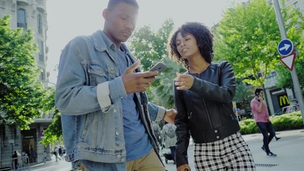 Wall Mural - Young happy black couple outdoors