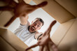 © master1305 - The surprised man unpacking, opening carton box and looking inside. The package, delivery, surprise, gift lifestyle concept. Human emotions and facial expressions concepts