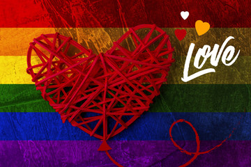 Red heart in the form of a balloon on the background of six colors, the pride of the lgbt with the inscription love