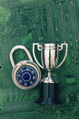 Poster - Data security expert. Padlock and trophy on a computer electronic circuit board.