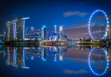 Singapore Skyline And View Of Skyscrapers On Marina Bay At Twilight Time.