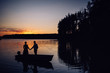 © Volodymyr - Silhouette of two lovers in boat on the lake at sunset. Photosession of couple on water