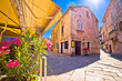 Sunny stone street of ancient Pula view