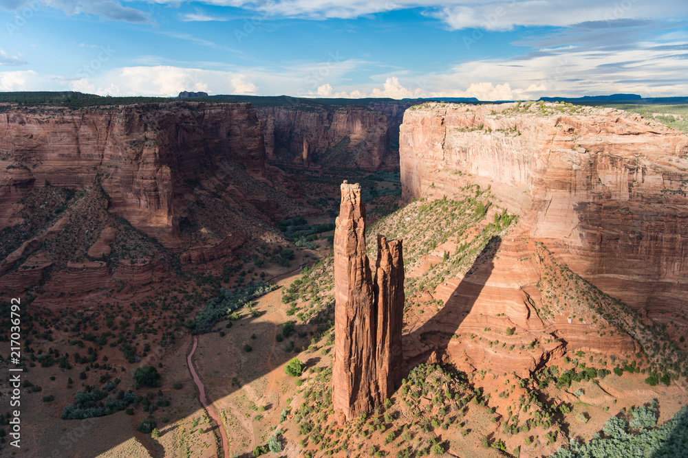 View of the Spider Rock rock spire in dramatic evening light in