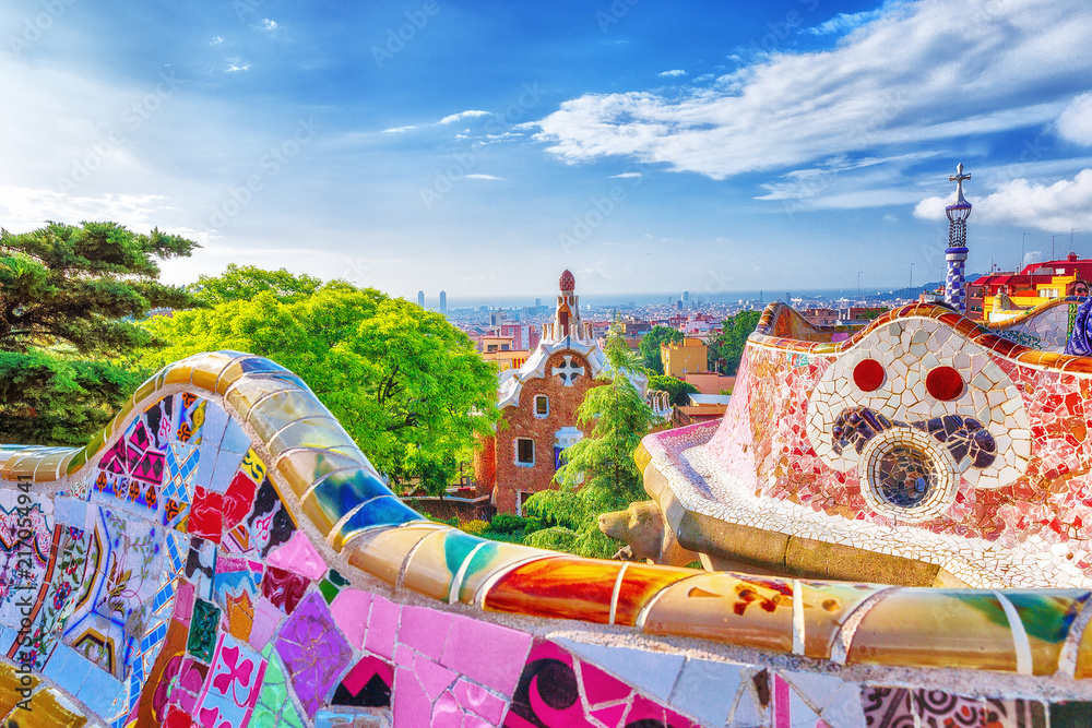 Barcelona, Spain. Gorgeous colorful view of Park Guell - the creation of great architect Antonio Gaudi. UNESCO world heritage site. - obrazy, fototapety, plakaty 