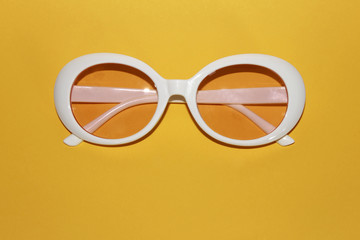 White woman's dough glasses, modern, latest fashion, yellow background