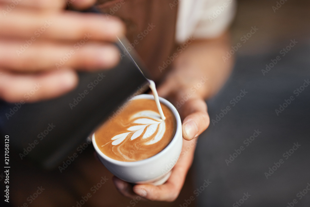 Coffee Art In Cup. Closeup Of Hands Making Latte Art  - obrazy, fototapety, plakaty 