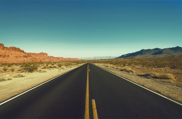 Poster - Asphalt road through the green field and