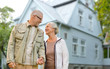 © Syda Productions - old age, accommodation and real estate concept - happy senior couple holding hands over living house background