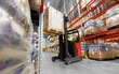 © Syda Productions - logistic business, shipment and loading concept - loader operating forklift with cargo at warehouse