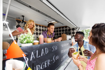 Poster - street sale, payment and people concept - happy customers buying burger at food truck