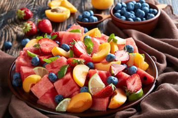 Wall Mural - sweet watermelon peach and berry salad