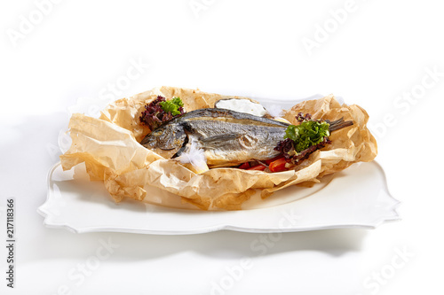 Fotografie, Obraz Dorado Baked with Tomato Salsa, Greens and Olives Isolated